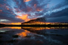 Sunset reflected in floodwaters on the 45th Parallel just north of Oamaru, Otago, New Zealand. From this point it is exactly 5000km to the South Pole and 5000km to the Equator.