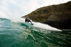 Elliott Brown coiled during a new swell at St Clair Beach, Dunedin, New Zealand. 