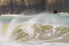 JC Susan airs off the back of the wave as an offshore wind feathers the lineup at a remote Catlins' beach, Catlins, New Zealand. 