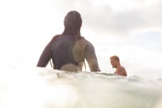 Odile Smits enjoys fun summer waves at Bethells Beach, Auckland, New Zealand.