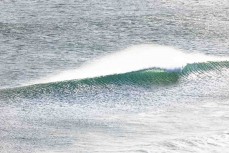 Playful summer wave at Blackhead Beach, Dunedin, New Zealand.