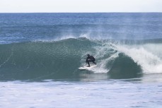 A surfer stalls for a barrel during a fun winter swell at Blackhead, Dunedin, New Zealand.
Photo: Derek Morrison