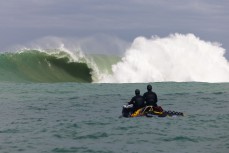 James Cross and Joe Dirt watch a wave break at a remote reef break in the Catlins, New Zealand. Photo: Derek Morrison