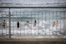 The Esplanade Restaurant team head out for their annual winter dip at St Clair, Dunedin, New Zealand.
Photo: Derek Morrison